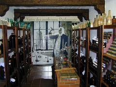Essenzenraum interior of the Duftmuseum Farina in Cologne with wooden shelves displaying various perfume essences