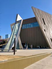 The Center for Civil and Human Rights building in Atlanta, GA, with modern glass architecture and bright blue sky