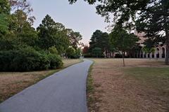 Park in the Arsenal Vienna with lush green trees and walking paths