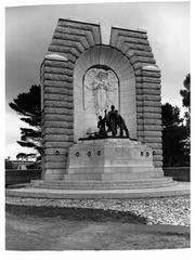 Front view of the National War Memorial with surrounding greenery and clear sky