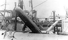 USS A-2 submarine loading a torpedo at Cavite Navy Yard circa 1912