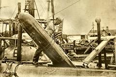 USS Adder submarine loading a Mark 7 torpedo on Manila Station around 1912