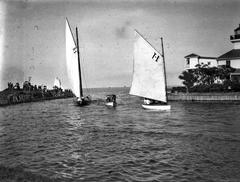 Boats entering New Basin Canal towards Lake Pontchartrain with lighthouse on the right in New Orleans