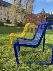 A pair of blue and yellow outdoor chairs at Saarland University