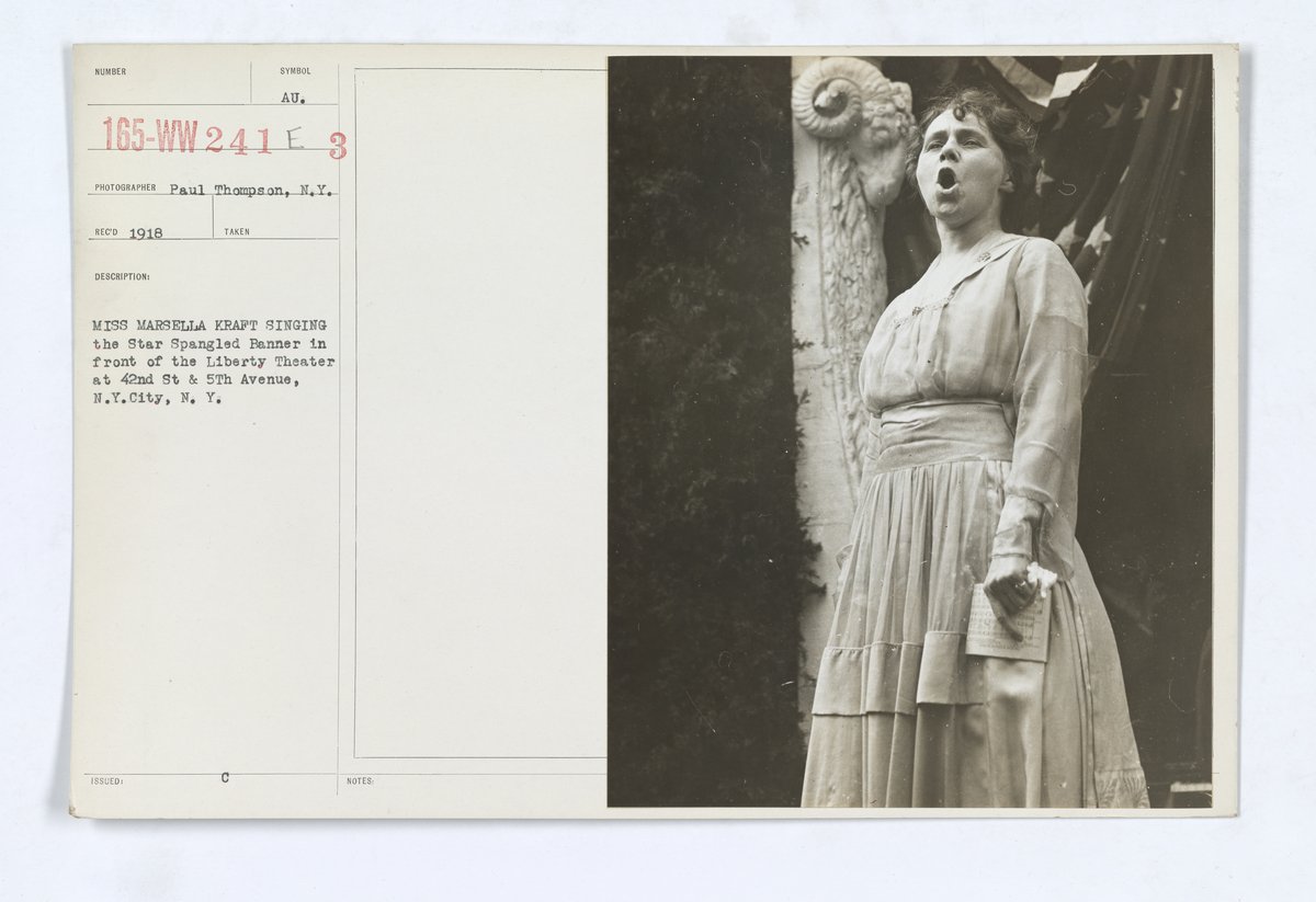 Miss Marsella Kraft singing the Star Spangled Banner in front of the Liberty Theater at 42nd St and 5th Avenue, New York City during the 3rd Liberty Bonds Campaign