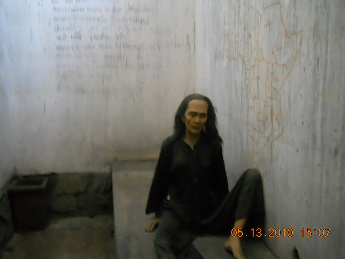 Statue of prisoner in the tiger cage at War Remnants Museum, Ho Chi Minh City