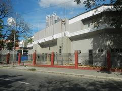 Intersection of Adriatico and Pablo Ocampo Streets in Malate, Manila with façades of Rizal Memorial Coliseum, Rizal Memorial Sports Complex, Philippine Sports Commission, and Rizal Memorial Stadium in 2019 under cloudy weather