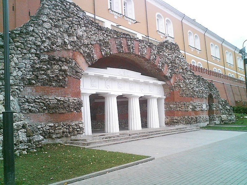 Grotto at Alexander Garden in Moscow Russia with historic stone architecture and green trees