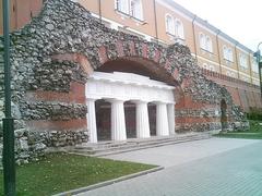 Grotto at Alexander Garden in Moscow Russia with historic stone architecture and green trees
