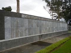 Camp Pangatian Memorial Shrine dedicated to the Raid at Cabanatuan with flagpoles and a wreath