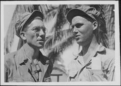 Staff Sergeant Bishop visiting Private Pierce after rescuing him from Cabanatuan prison camp in Luzon during WWII
