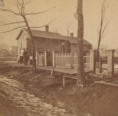 Historic image of Catherine O'Leary's cottage on DeKoven Street, Chicago, 1871
