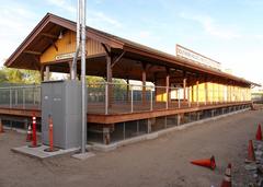 Toluca Southern Pacific Depot and Pacific Electric Lankershim Station surrounded by fencing from southwest view