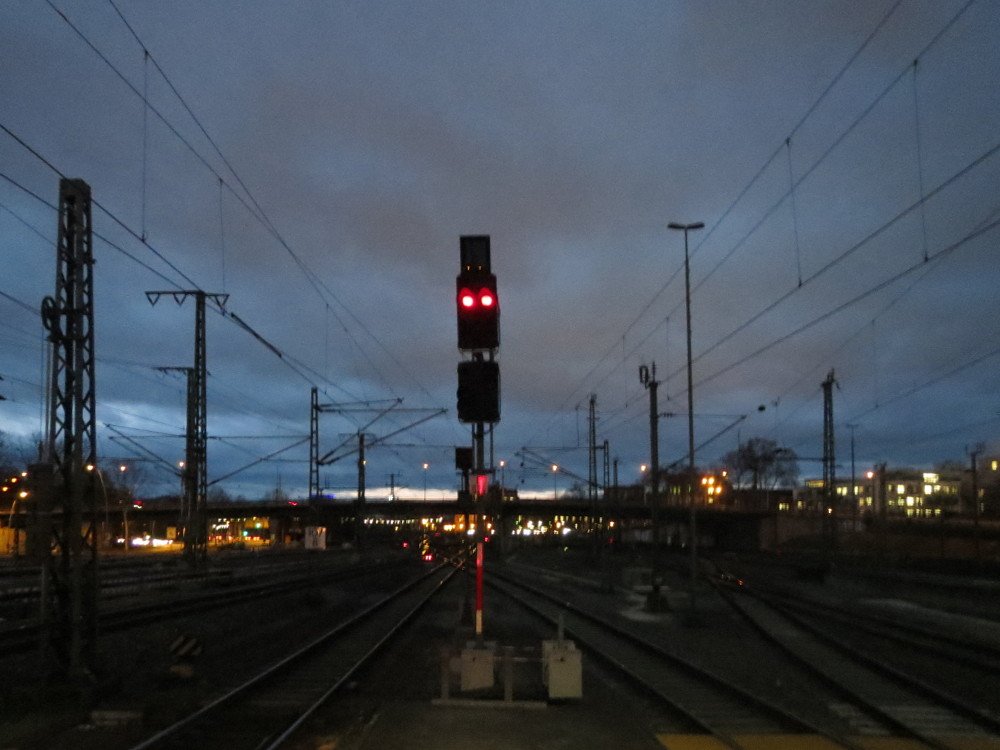 Mannheim Hauptbahnhof railway station illuminated at evening with modern architecture and busy platforms