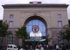 Main station entrance of Mannheim, Germany with modern architecture and people walking