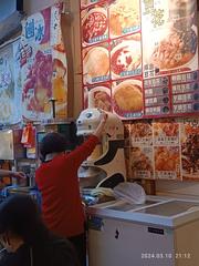 Raohe Street Night Market in Taipei Taiwan bustling at night with colorful food stalls