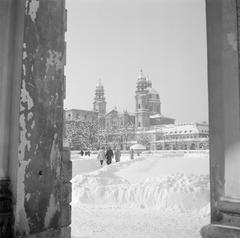 Snow-covered Hofgarten park with Theatinerkirche church in the background, Munich, winter 1958