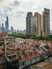 Old Shanghai streets in Huangpu District with busy city life and traditional architecture