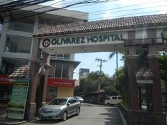 San Dionisio Bridge in Sucat area of Parañaque City with nearby landmarks including SM City Sucat, Olivarez College, Olivarez Hospital, and Liana's Supermarket along Dr. A. Santos Avenue