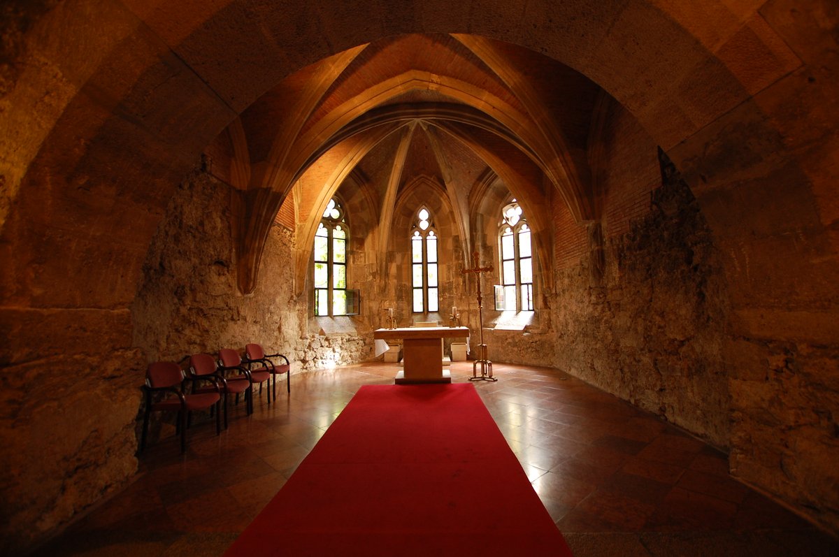 Interior of Buda Castle Church with ornate architectural details and decorative elements