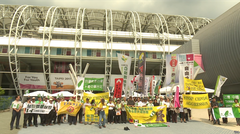 Taiwan independence movement groups protest at Taipei Stadium entrance holding Taiwan flags and banners