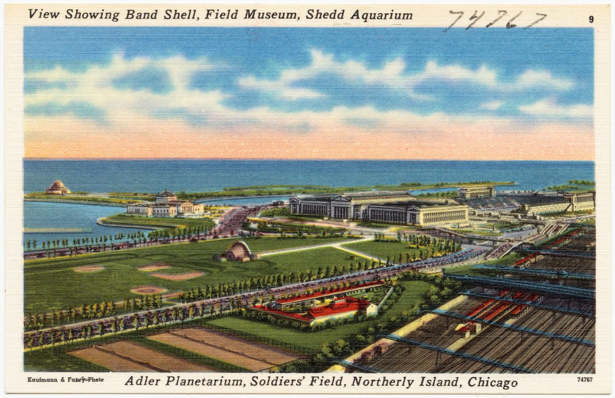 View of band shell with Field Museum, Shedd Aquarium, Adler Planetarium, Soldiers' Field, and Northerly Island in Chicago in the background