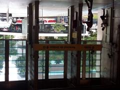 Exit of Pinheiros Station with people walking and bicycles parked