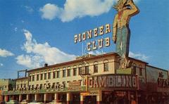 1950s postcard of Pioneer Club with tall Vegas Vic neon sign on Fremont Street, Downtown Las Vegas