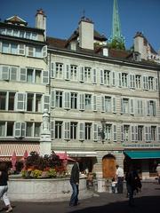 Scenic view of Place du Bourg-de-Four in Geneva, Switzerland with historic buildings and cafes