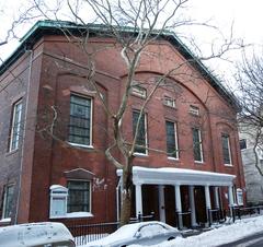 Plymouth Church of the Pilgrims covered in snow on a sunny late afternoon