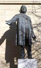 Statue of Henry Ward Beecher in the yard of Plymouth Church on a sunny midday