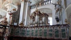 Historic Kloster St. Peter monastery building with arched windows and tiled roofs