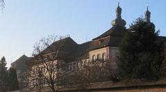 Historic St. Peter's Abbey monastery building with stone architecture and sloped roofs