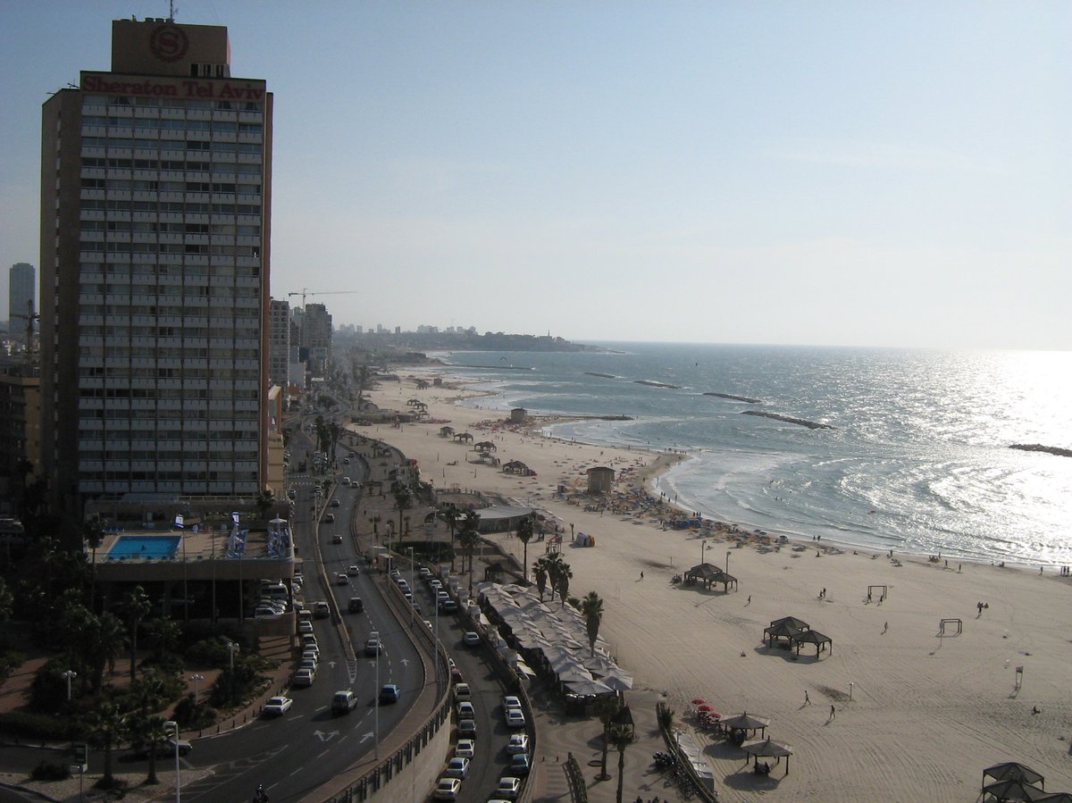 Night aerial view of Tel Aviv city with illuminated buildings and streets