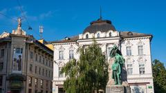 Scenic view of Ljubljana city with Ljubljana Castle on the hill and peaceful river in the foreground