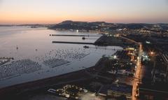 Gulf of Pozzuoli and Bagnoli district viewed from Virgiliano Park in Naples at sunset with Via Coroglio in the foreground