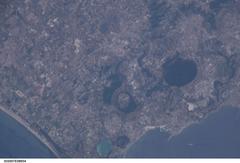 Aerial view of Italy from space showing the Italian peninsula surrounded by the Mediterranean Sea