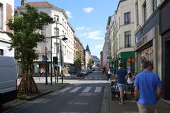 Street view of Rue Blaes near Rue Saint-Ghislain in Brussels with buildings and parked cars in 2024