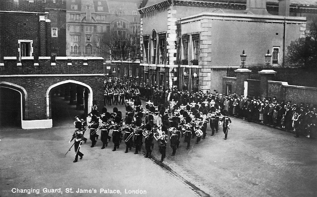 Changing of the Guard ceremony at Queen's Chapel, St. James's Palace with many musicians and a small crowd