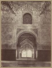 Interior view of the Alhambra palace in Granada showing intricate architecture and detailed decorations
