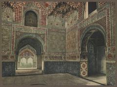 The iconic Sala de las Dos Hermanas interior in the Alhambra palace of Granada with intricate Islamic architectural details from the entry door perspective