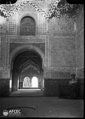 Interior rooms of the Alhambra with a foreground fountain and the Daraxa lookout in the background