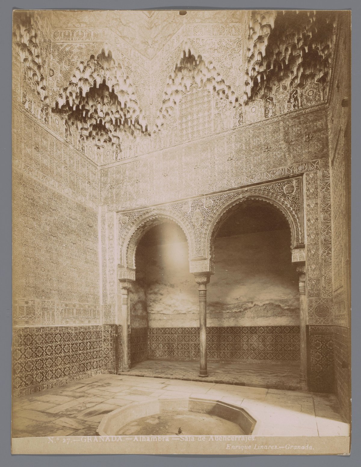 Interior view of the Sala de Abencerrajes at the Alhambra palace in Granada, showcasing intricate Moorish architectural details