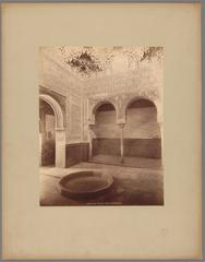 Interior of the Hall of the Abencerrajes in the Alhambra Palace, Granada, showcasing intricate Moorish architecture and an indoor fountain