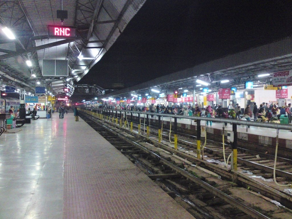 Ranchi Junction Railway Station at night with illuminated platforms and trains