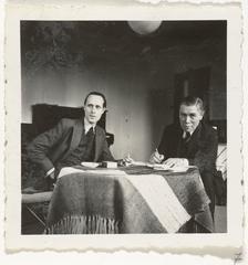 Black and white portrait photograph of Carel Willink and A.M. Hammacher seated at a table circa 1930