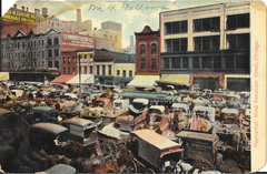 Front view of a vintage postcard showing the Haymarket area on West Randolph Street in Chicago, Illinois