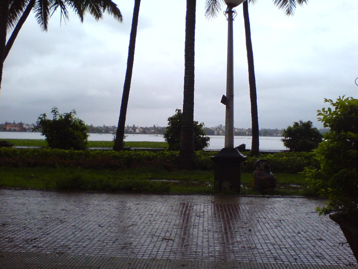 Scenic view of Rankala Lake with hills in the background in Kolhapur, India