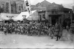 Festival of Taiwan Shrine parade passing through Nishimon Market near Ximen Red House