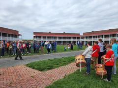 Fort McHenry Guard playing fife and drums during a rehearsal with onlookers including rangers and visitors